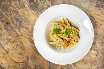 Italian  pasta spaghetti bolognese with tomatoes, cheese and fresh basil in a plate.