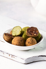 Truffle sweets with dark chocolate and white chocolate with matcha tea