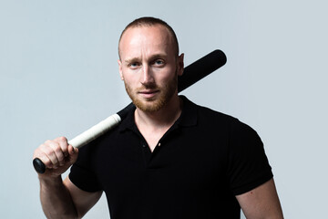 Guy with baseball bat. Dangerous man with serious emotion. Self defense.