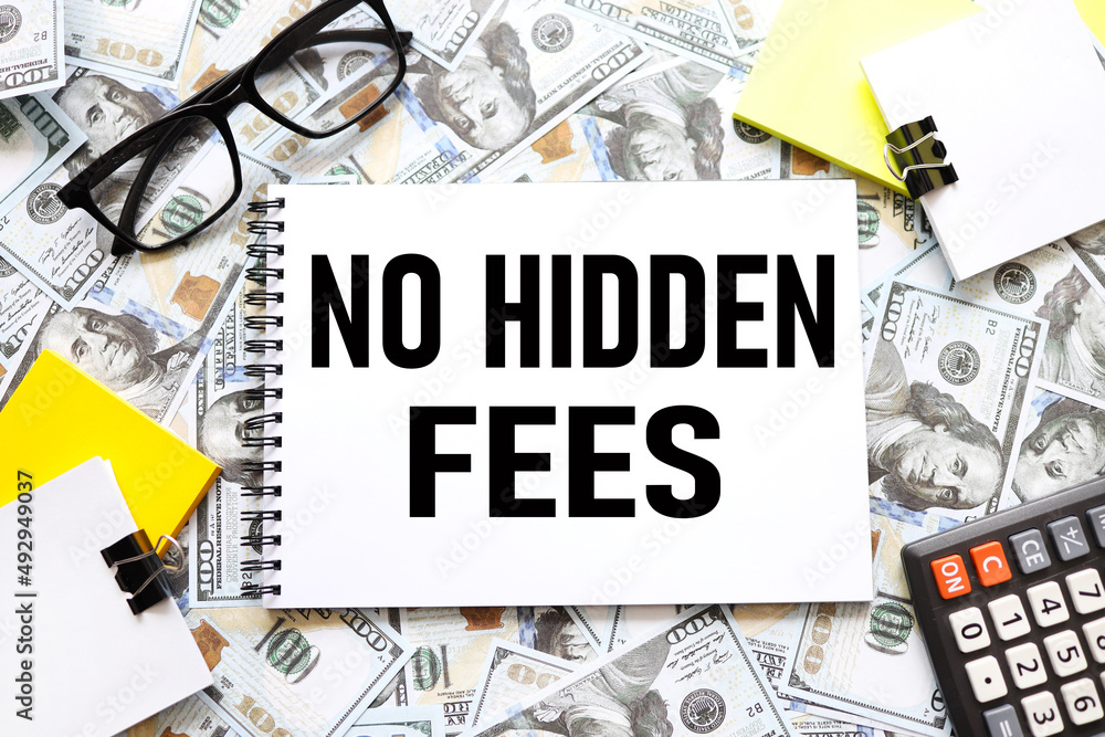 Poster no hidden fees text on an open notebook. many dollar bills scattered
