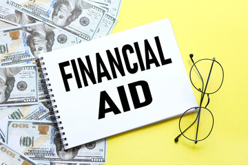 Financial Aid yellow background text on notebook
