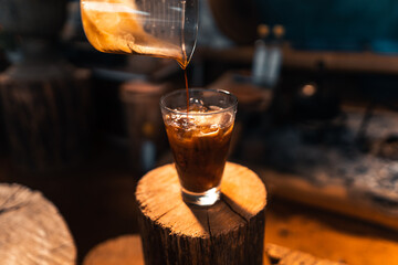 iced coffee in a glass making iced americano
