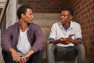 Chilling on campus. Cropped shot of two university students hanging out between class.