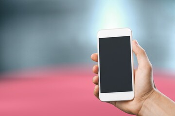 Hand holds phone Sample social media app interface on mobile phone showing shared video content