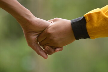 close up of people shaking hands