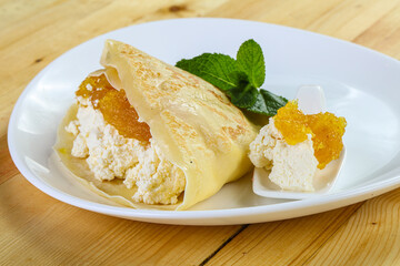 Pancake with cottage cheese and jam