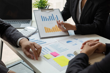 Business leaders talk about charts, financial graphs showing results are analyzing and calculating planning strategies, business success building processes