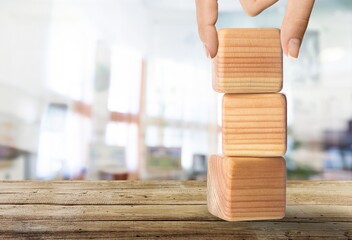 Hand hold wood cube with symbol  Business concept. Instructions to assist employee  in complex...