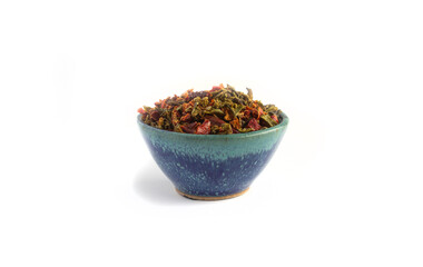Dried Sweet Bell Peppers in Blue Pottery Bowl Isolated on White