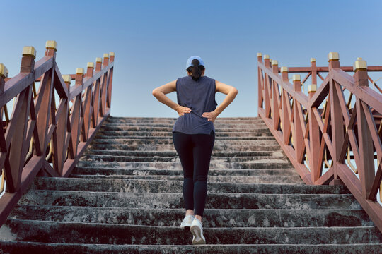 Woman exercise walking up the stairs burn fat, Healthy lifestyle concept.