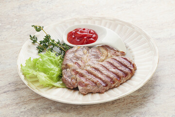 Grilled pork neck steak with ketchup