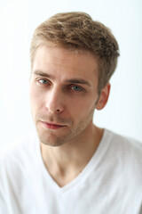 Obraz premium Young man checking his stubble in bathroom