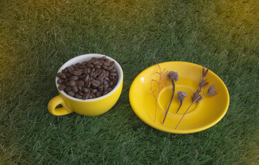 Yellow coffee cup with roasted aroma beans