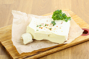 Greek Feta cheese over board