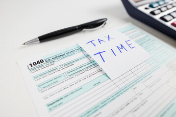 Tax return form 1040 on the table. financial document.