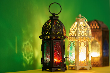 arabic lantrn for ramadan decoration against green background
