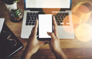 Shes always reachable. High angle shot of an unrecognizable businesswoman using a mobile phone.
