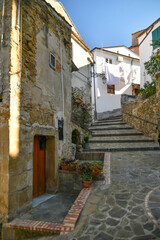 Fototapeta na wymiar A narrow street among the old stone houses of Altavilla Silentina, town in Salerno province, Italy. 