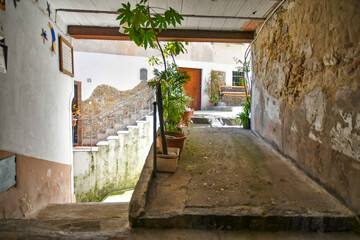 A narrow street among the old stone houses of Altavilla Silentina, town in Salerno province,...