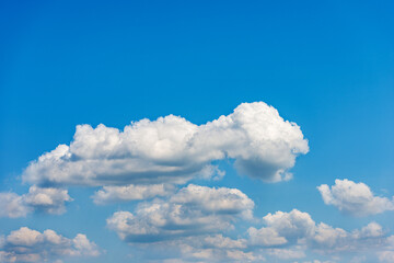 Beautiful storm clouds, cumulus clouds or cumulonimbus against a clear blue sky. Photography, Full frame.