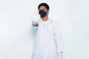 portrait of asian medical doctor wear masks with open hand doing stop sign Isolated on white background
