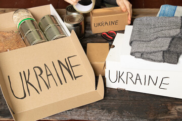 Collecting a humanitarian food set to help people who suffered during the war at the hands of...