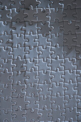 Close up of textured white jigsaw puzzle