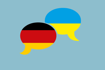 Zwei Sprechblasen in den Farben von Deutschland und der Ukraine. Konzept Dialog zwischen den Ländern oder Menschen
