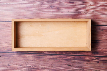  empty wood crate on wooden background