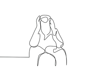 a person sitting sad fussy worried puts his hands on his head