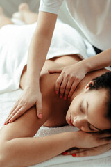 Young woman making massage at spa center 