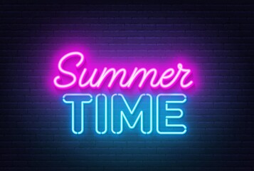 Summer Time neon quote on a brick wall.