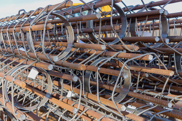 Reinforcing cages for bored piles stacked at the construction site. Reinforcement of reinforced concrete piles.