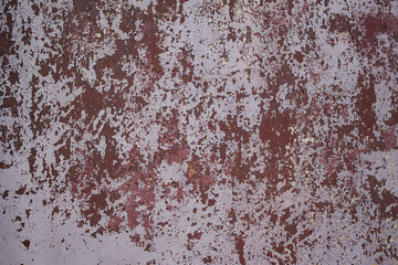 Pattern and texture of old dried paint on a rough metal surface