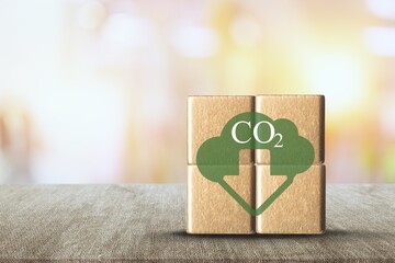 CO2 emission concept. Green industries business concept. Wooden cubes with reduction icon.