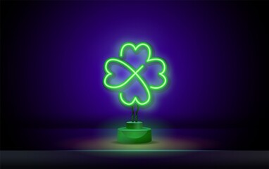 Neon green shamrock sign isolated on dark background. Glowing clover - irish and St. Patrick's Day symbol for cards, banners, posters.