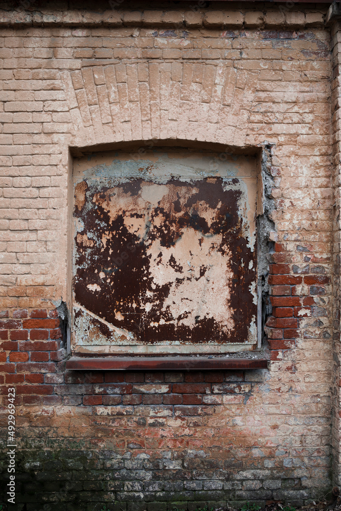 Sticker window of the old brick house .