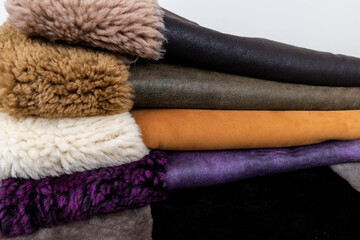 Leather fabrics obtained from natural animals, not yet processed. colored leather pieces hanging