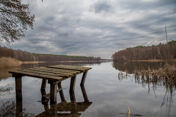 wooden pier on the lake in Powidz Poland