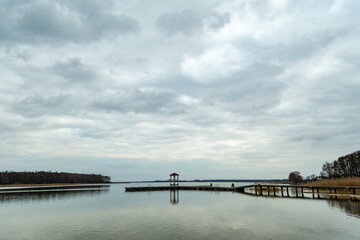 small wooden dock on a lake in Powidz Poland