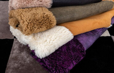 Leather fabrics obtained from natural animals, not yet processed. colored leather pieces hanging