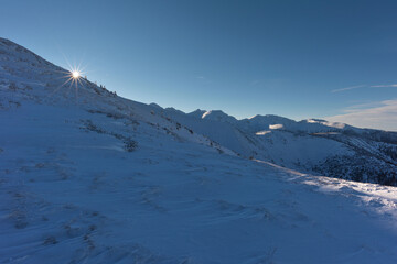 Beautiful winter views of the High Tatra Mountains with tourists, skiers and amazing states of nature