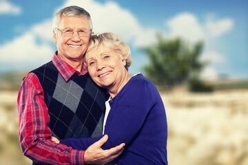 Happy active senior couple outdoors posing