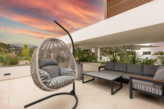 Egg chair swing on a luxury terrace