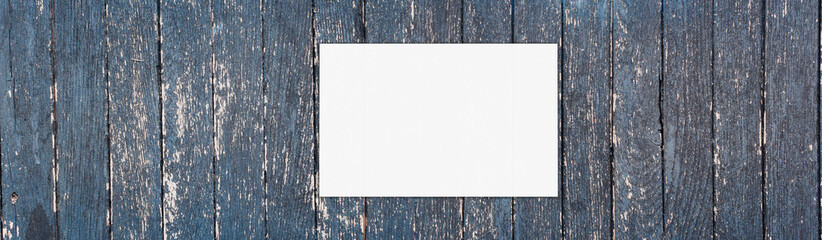 Fototapeta  Naturalne Tło starej obdartej z farby ściany z drewnianych desek z białą ramką z miejscem na tekst. obraz