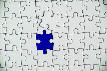 Fototapeta premium Top view of missing jigsaw puzzle. Conceptual