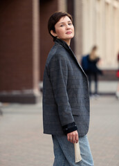 Beautiful woman on the street. Street style fashion.