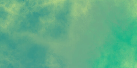 blue background. Colorful watercolor background of abstract sunset sky with puffy clouds in bright green and yellow color design. modern watercolor design wash aqua painted texture close up, grungy