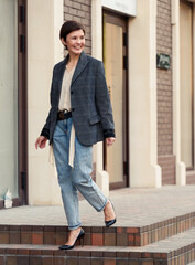 Beautiful woman on the street. Street style fashion.