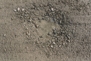 Dirt road with holes and potholes